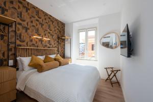 a bedroom with a large white bed and a window at Sistine Chapel View Rooms Check-in From 3 Pm To 10 Pm in Rome