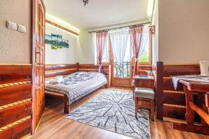 Postel nebo postele na pokoji v ubytování Dom Wypoczynkowy Wierchy