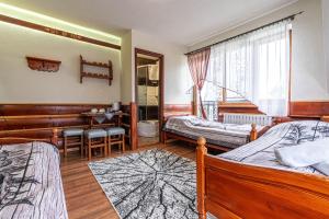 Postel nebo postele na pokoji v ubytování Dom Wypoczynkowy Wierchy