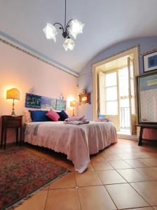 Posteľ alebo postele v izbe v ubytovaní Vittorio Emanuele Rooms di Prinzi