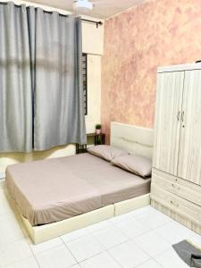 Postel nebo postele na pokoji v ubytování Isyfaq Apartment Homestay Serdang UPM Bukit Jalil + 18 fotografií