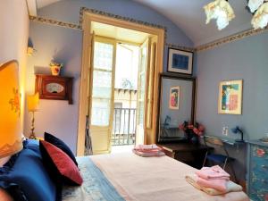 Posteľ alebo postele v izbe v ubytovaní Vittorio Emanuele Rooms di Prinzi