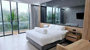 Postel nebo postele na pokoji v ubytování Villa sát biển 5 phòng ngủ Lagi + 29 fotografií