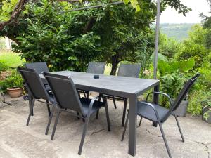 a gray table and chairs sitting on a patio at Portorož Apartments Franca in Portorož