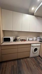Kuchyň nebo kuchyňský kout v ubytování John Apartment 2