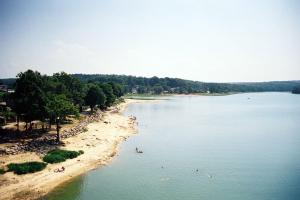 a large body of water with people on a beach at Mozane in Chantraine