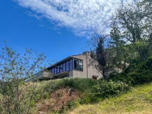 a house sitting on top of a hill at Kelowfornia Lakeview Retreat in Kelowna