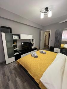 Postel nebo postele na pokoji v ubytování John Apartment 2