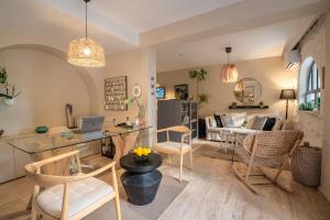 a kitchen and living room with a table and chairs at True Blue Boutique Hotel Kalkan in Kalkan