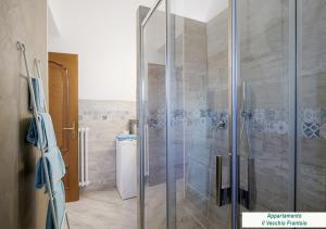 a bathroom with a shower with a glass door at Agriturismo Le Girandole in Diano Marina +26 photos
