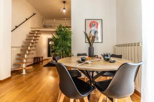 a dining room with a table and chairs at I_Like_Sassari Apartment2.0 in Sassari +42 photos
