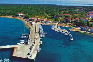 an aerial view of a marina with boats in the water at Vila Klara room - garden view in Olib