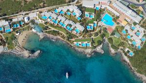 an aerial view of a resort near the ocean at Elounda Mare Relais & Châteaux Hotel in Elounda