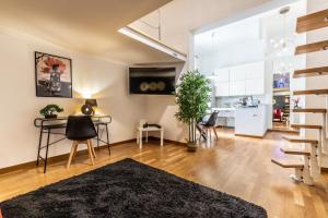a living room with a table and chairs at I_Like_Sassari Apartment2.0 in Sassari