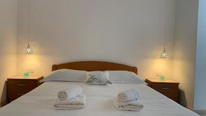 Postel nebo postele na pokoji v ubytování Apartments Leut