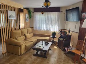 a living room with a couch and a table at Hotel Vasco Da Gama in Sabaris