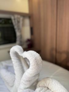 a pile of towels sitting on top of a counter at Tayys Inn Luxury Camp in Birmingham