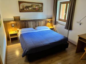 Postel nebo postele na pokoji v ubytování Garni Eden Bed and breakfast