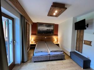 Postel nebo postele na pokoji v ubytování Garni Eden Bed and breakfast
