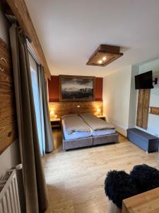 Postel nebo postele na pokoji v ubytování Garni Eden Bed and breakfast