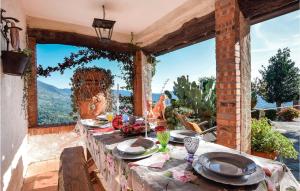 a table with plates of food on top of a patio at Casa La Borra in Camaiore