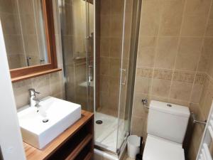 a bathroom with a sink and a shower and a toilet at Appartement de 3 pièces au centre d'Isola 2000, parking, proche pistes - FR-1-292-210 in Isola +4 photos