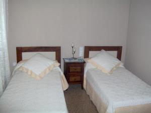 Posteľ alebo postele v izbe v ubytovaní Hostal Restaurante Arasa
