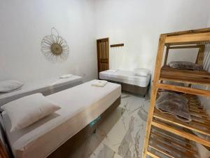 a room with two bunk beds and a ladder at Recanto do Matuto in Amargosa
