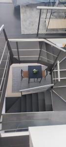 an overhead view of a bench in a building at La Cueva del Sacristán in Luanco