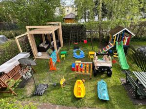 a toy yard with a playground and play equipment at Piast in Karwia