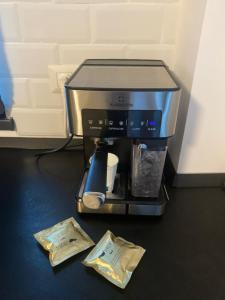 a coffee maker sitting on top of a counter at Ozone Rezidence in Focşani