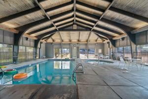 an indoor swimming pool with a wooden ceiling at Windward Pointe 1401-Large balcony best views in Orange Beach