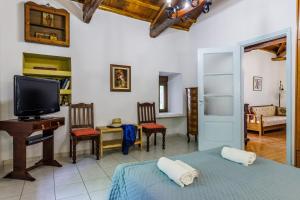 Postel nebo postele na pokoji v ubytování Pefkos Cottage