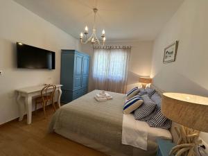 Postel nebo postele na pokoji v ubytování Bed & Breakfast Lupis
