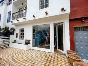 a store front with a glass door at Taouarguit Guest House in Imsouane