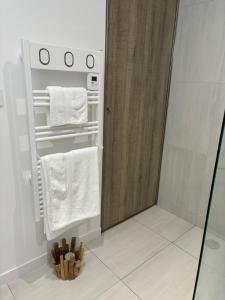a bathroom with a shower and white towels at Villa Casa Sole e Mare in Conca +28 photos