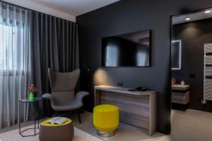TV a/nebo společenská místnost v ubytování Hotel Doriguzzi