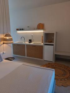 a kitchen with a sink and a counter at Petra Lodge in Finikas +44 photos