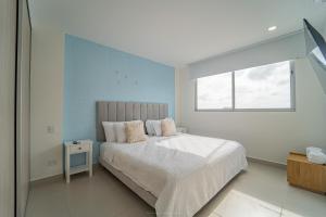 Postel nebo postele na pokoji v ubytování Encanto Rentals at Sunno Beach + 67 fotografií