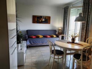 a living room with a blue couch and a table at Astralis in Trogir