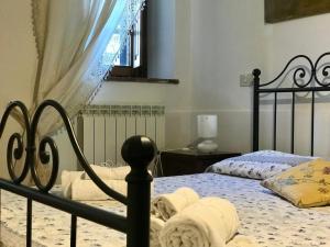 Postel nebo postele na pokoji v ubytování Agriturismo Melodie Toscane Sorano