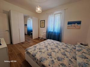 Ένα ή περισσότερα κρεβάτια σε δωμάτιο στο La casetta al mare di Bubi