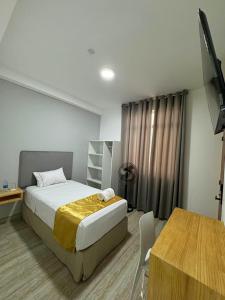 Postel nebo postele na pokoji v ubytování Bendezu Hotel