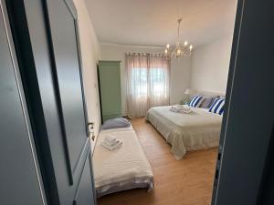 Postel nebo postele na pokoji v ubytování Bed & Breakfast Lupis