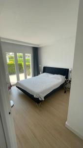 a bedroom with a bed in a room with a window at Family-friendly Beach Escape- 130m2 of pure joy in Port de Pollensa +30 photos