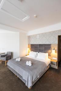 Posteľ alebo postele v izbe v ubytovaní Hotel Kopczyński