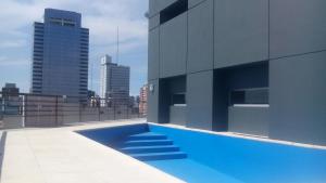 a swimming pool on the roof of a building at Departamento Bernardo de Irigoyen in Buenos Aires