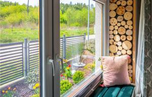 a window seat with a view of a garden at Nice Home In Gniewino With Kitchen in Gniewino