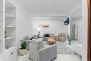 a living room with a couch and a table at Villas Plitka in Tivat