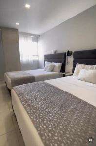 Uma cama ou camas num quarto em Hotel OR Suite